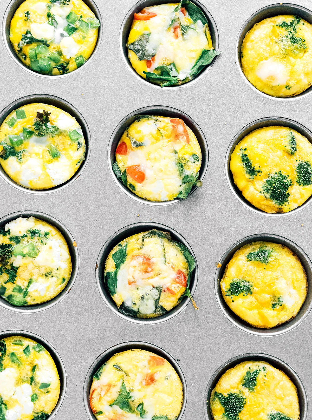 Cooked egg muffin cups in a muffin tin