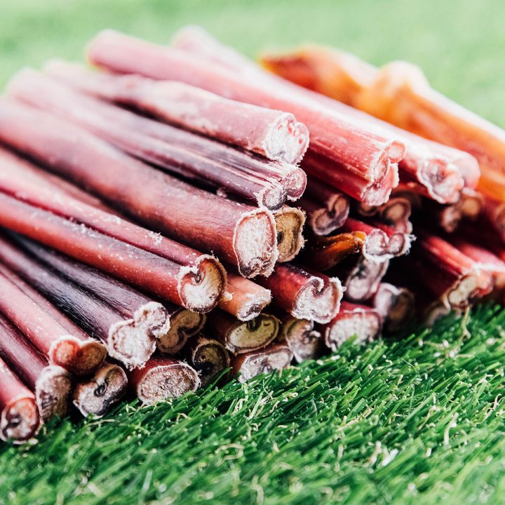 Bully sticks in a stack on grass