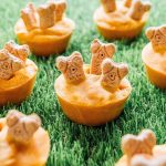 Boneyard halloween dog treats on grass.