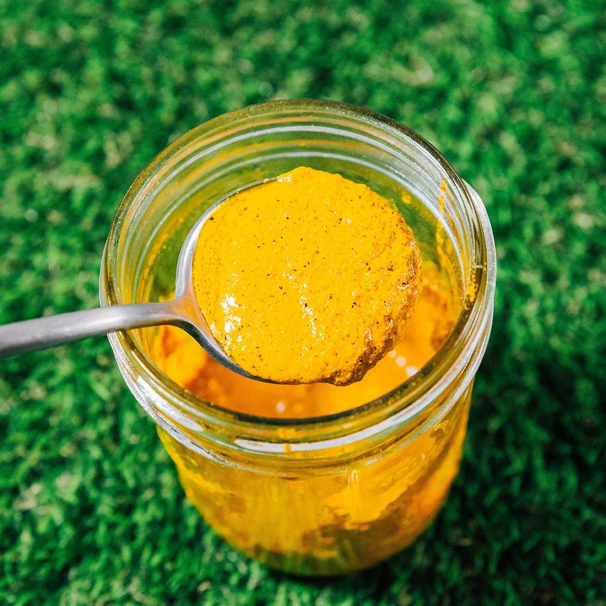 Spoon full of golden paste.