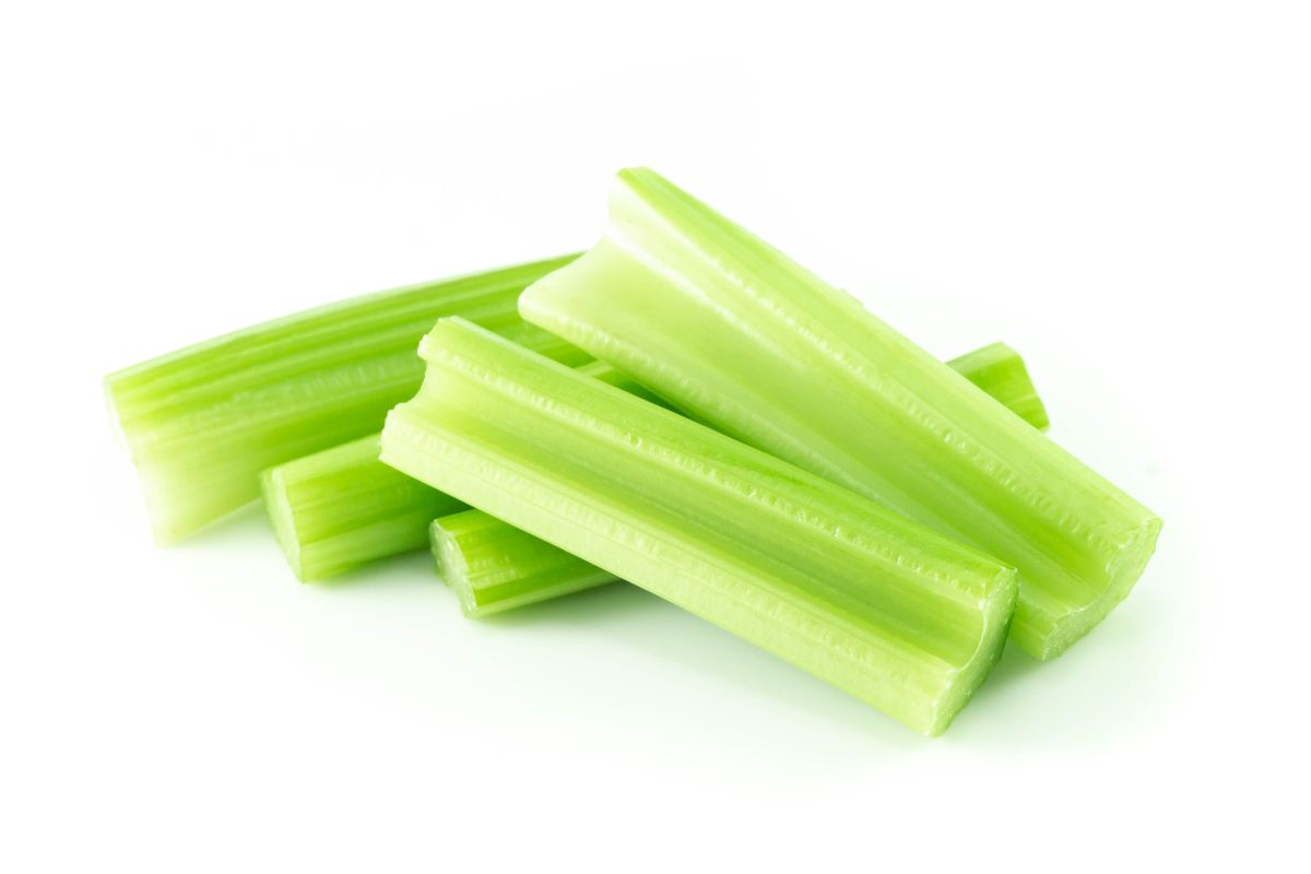 Celery sticks on a white background.