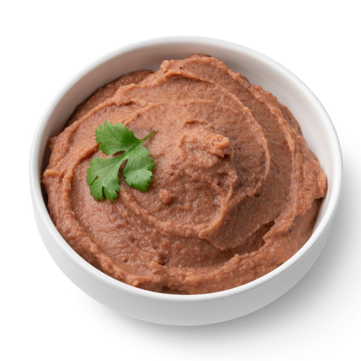 A bowl of refried beans on a white background.